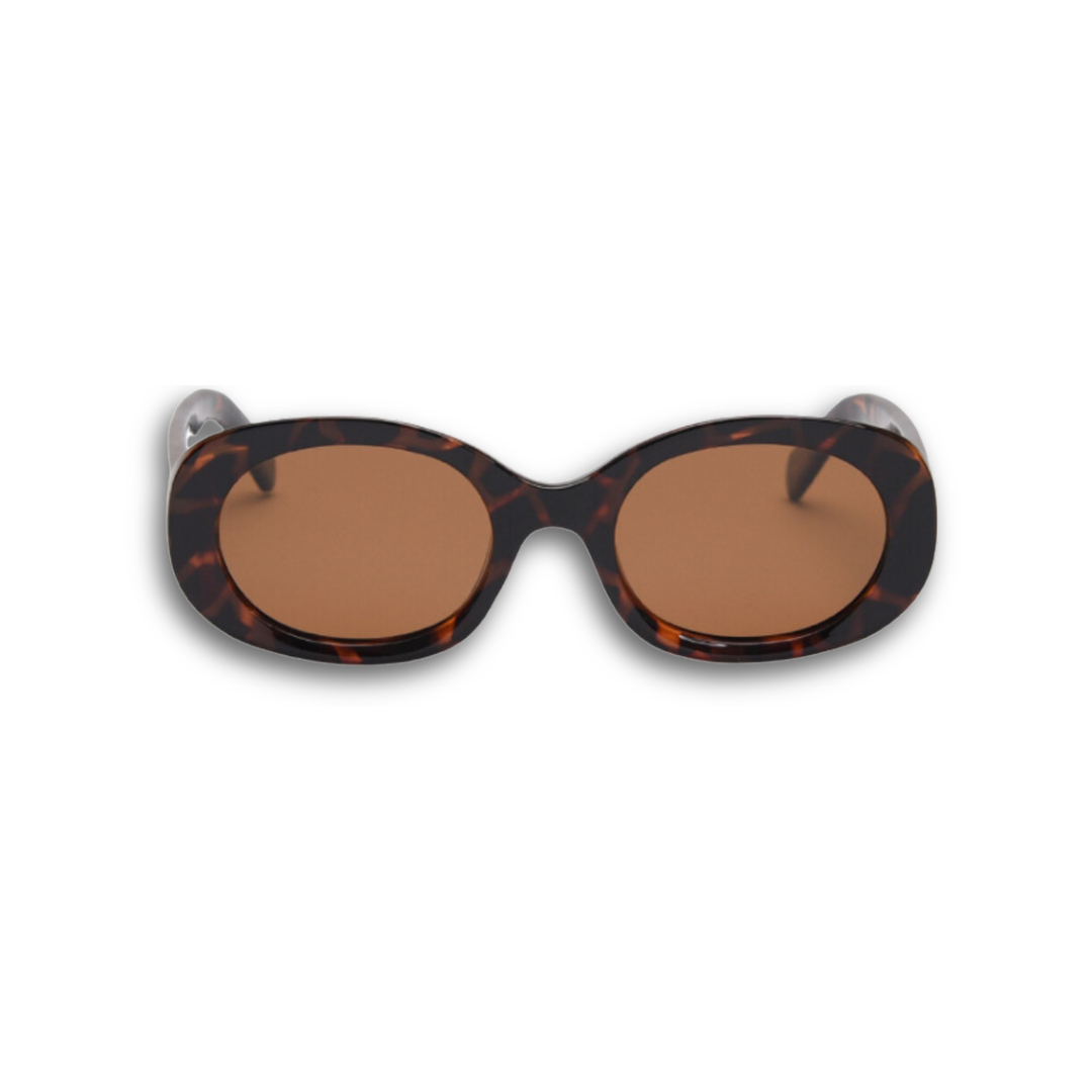 Classic dark tortoise shell oval sunglasses with brown polarized lenses and UV protection, retro aesthetic bold frame eyewear for women.
