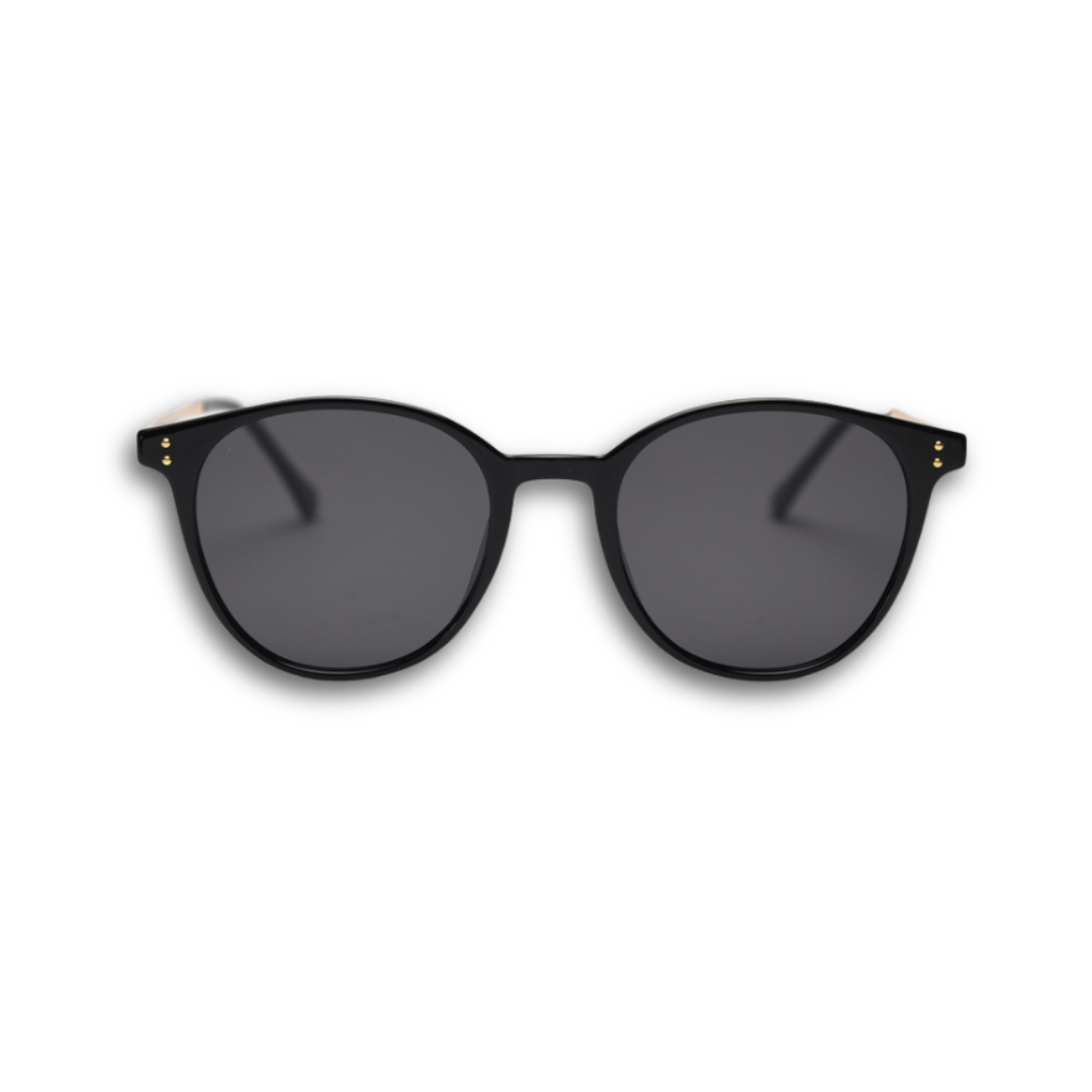 Black sunglasses with dark lenses on a white background. Unisex tortoiseshell round sunglasses with UV protection, polarised lenses, trendy fashion design.