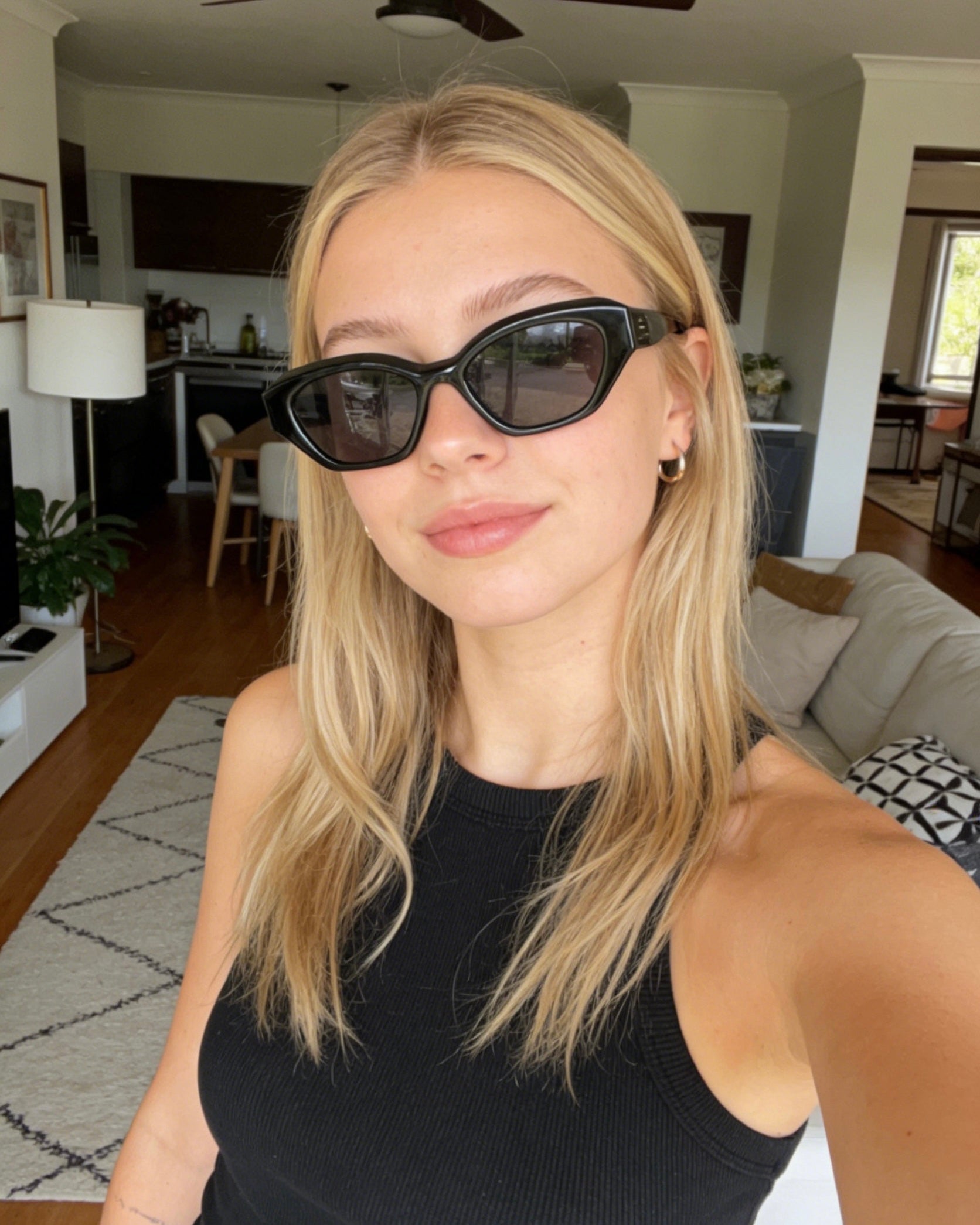 Stylish unisex polarized cat-eye sunglasses by By Charley, featuring a classic black frame that offers 100% UV protection and glare reduction for a bold, vintage-inspired aesthetic.