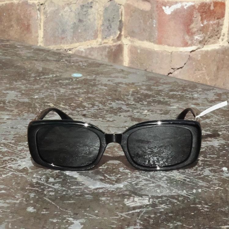 Unisex trendy sunglasses with modern polarised lenses. Stylish rectangle sunglasses inspired by classic vintage fashion.