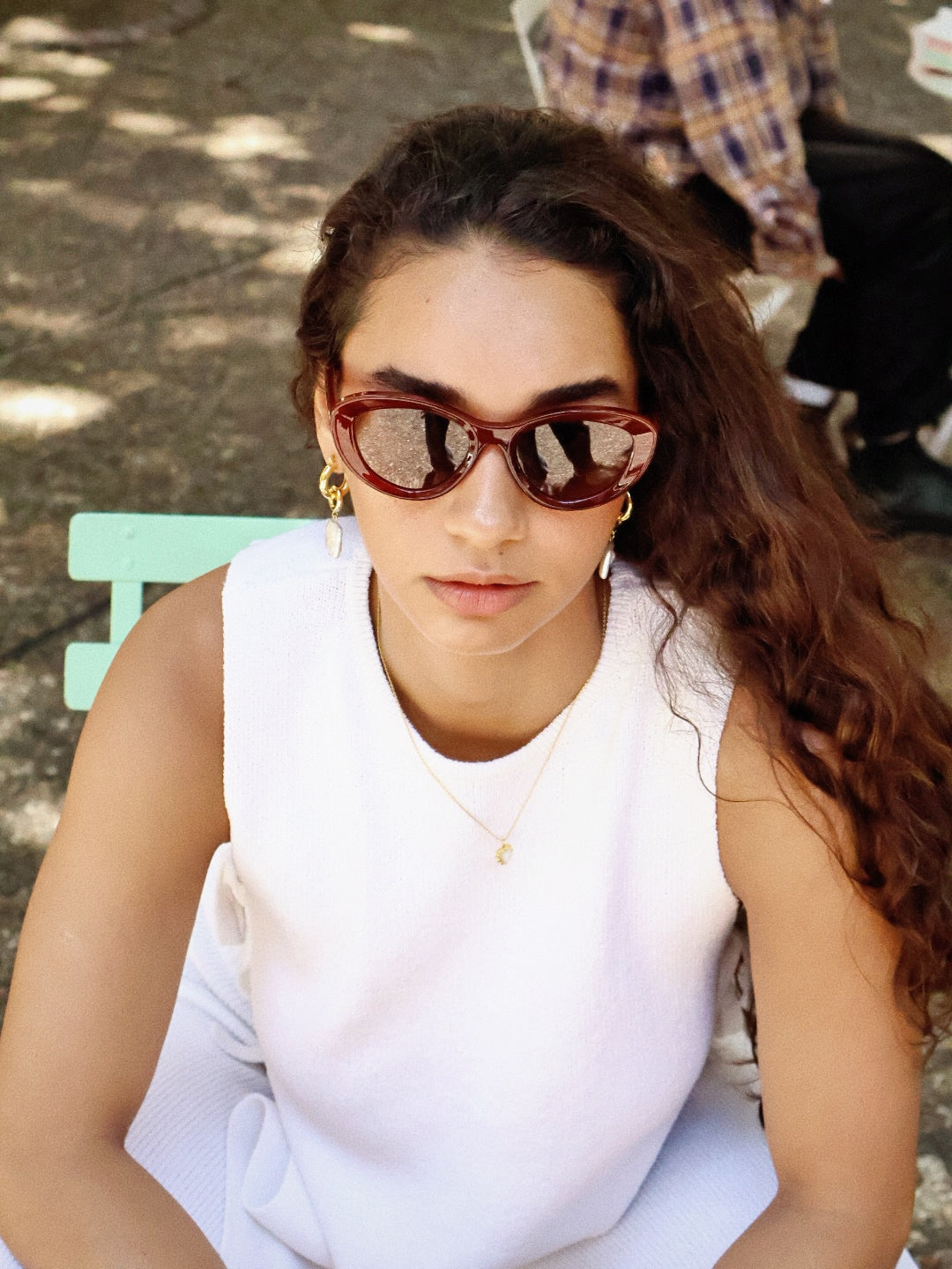 Stylish unisex cat-eye sunglasses by By Charley, featuring a rich reddish-brown frame and polarized lenses that offer 100% UV protection and glare reduction for a confident, retro-inspired statement.