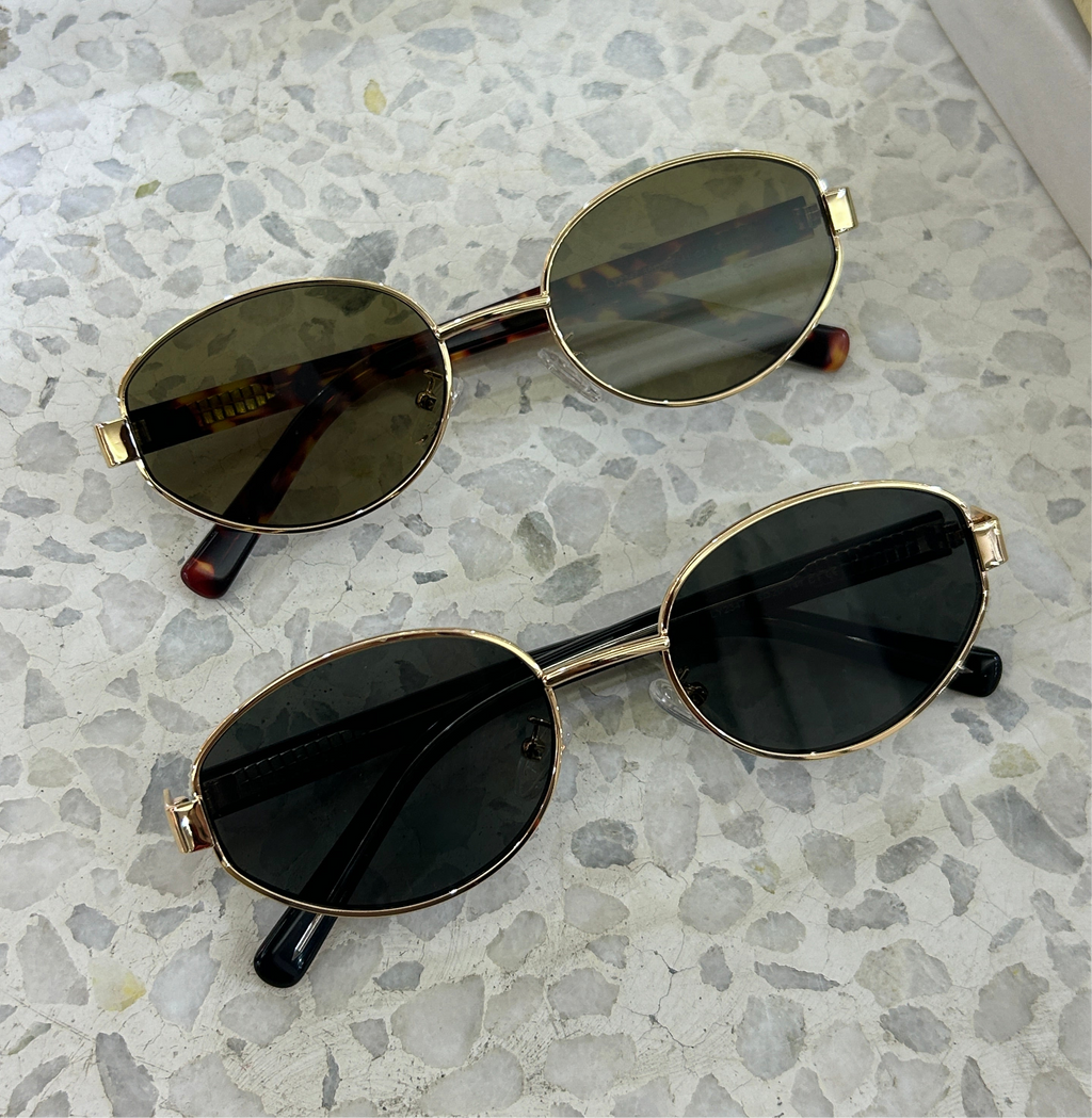 Classic unisex round sunglasses by By Charley, featuring polarized lenses that offer 100% UV protection and anti-glare functionality with a timeless vintage aesthetic.