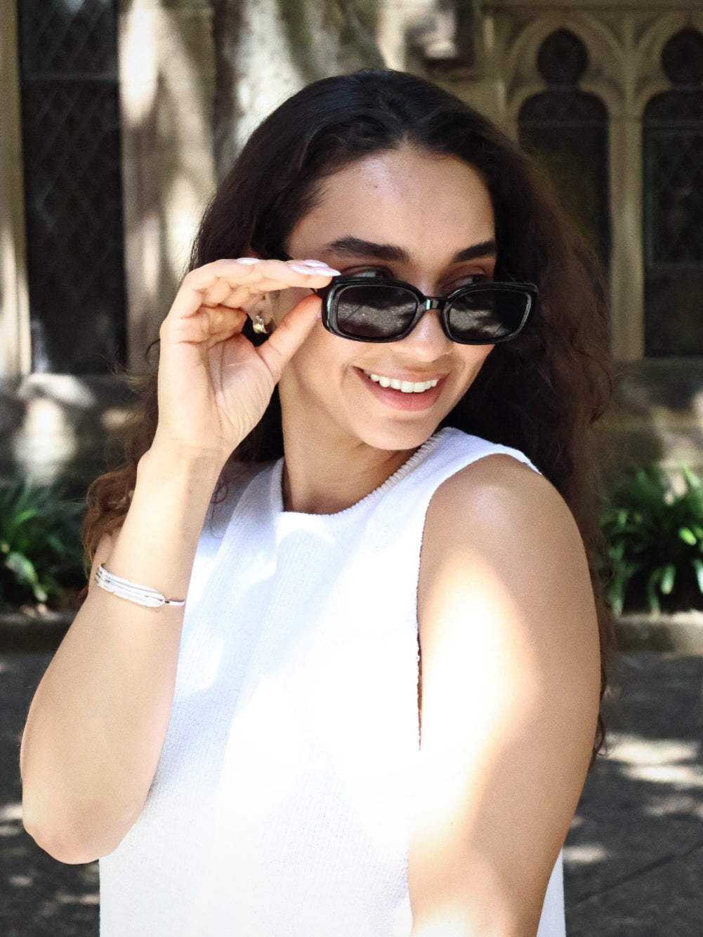 Classic black rectangle sunglasses with polarized lenses and UV protection, retro 90s inspired slim frame eyewear for women. Aesthetic chic everyday eyewear.