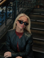 Stylish unisex polarized cat-eye sunglasses by By Charley, featuring a classic black frame that offers 100% UV protection and glare reduction for a bold, vintage-inspired aesthetic.
