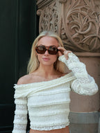 Make a statement with these By Charley unisex aviators, combining a tortoiseshell frame with vibrant orange polarized lenses for a unique, retro-inspired style.