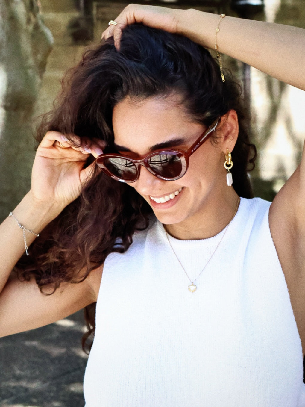 Stylish unisex cat-eye sunglasses by By Charley, featuring a rich reddish-brown frame and polarized lenses that offer 100% UV protection and glare reduction for a confident, retro-inspired statement.