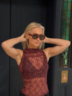 Make a statement with these By Charley unisex aviators, combining a tortoiseshell frame with vibrant orange polarized lenses for a unique, retro-inspired style.