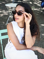 Stylish unisex square sunglasses by By Charley, featuring a classic tortoiseshell frame and polarized lenses that provide 100% UV protection and glare reduction for a confident, architectural aesthetic.