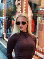 Classic unisex round sunglasses by By Charley, featuring polarized lenses that offer 100% UV protection and anti-glare functionality with a timeless vintage aesthetic.