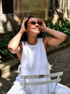 Make a unique statement with these playful oval sunglasses from By Charley. The retro unisex design in a warm pumpkin color features polarized lenses for all-day comfort.