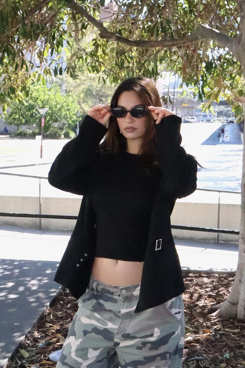 Playful and retro unisex oval sunglasses by By Charley, featuring a distinctive tortoiseshell frame and polarized lenses that offer 100% UV protection and glare reduction for a unique, fashion-forward look.