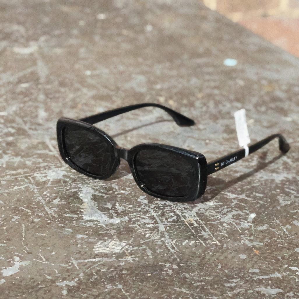 Unisex trendy sunglasses with modern polarised lenses. Stylish rectangle sunglasses inspired by classic vintage fashion.