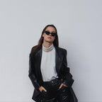 Embrace a playful and dramatic retro vibe with these By Charley unisex black cat-eye sunglasses featuring polarized lenses.