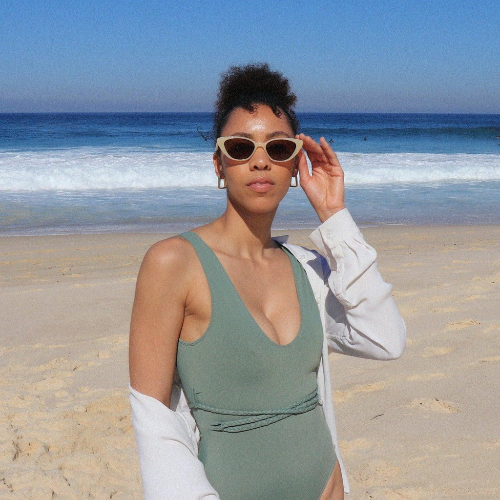 Playful unisex cat-eye sunglasses by By Charley, featuring a bold lemon frame and polarized lenses that offer 100% UV protection and glare reduction for a fun, retro-inspired statement.