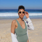 Playful unisex cat-eye sunglasses by By Charley, featuring a bold lemon frame and polarized lenses that offer 100% UV protection and glare reduction for a fun, retro-inspired statement.