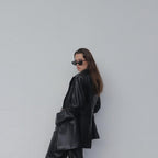 Embrace a playful and dramatic retro vibe with these By Charley unisex black cat-eye sunglasses featuring polarized lenses.