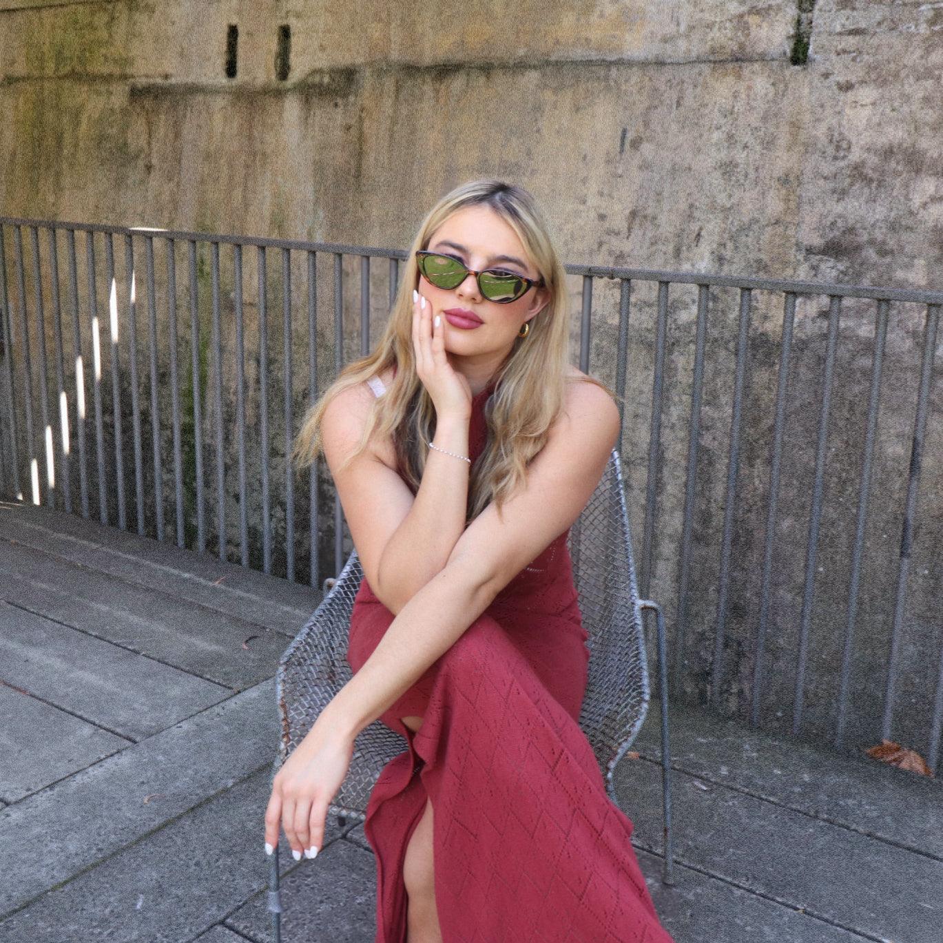 Playful unisex cat-eye sunglasses by By Charley, featuring a classic tortoiseshell frame and polarized lenses that offer 100% UV protection and glare reduction for a dramatic, retro-inspired statement.